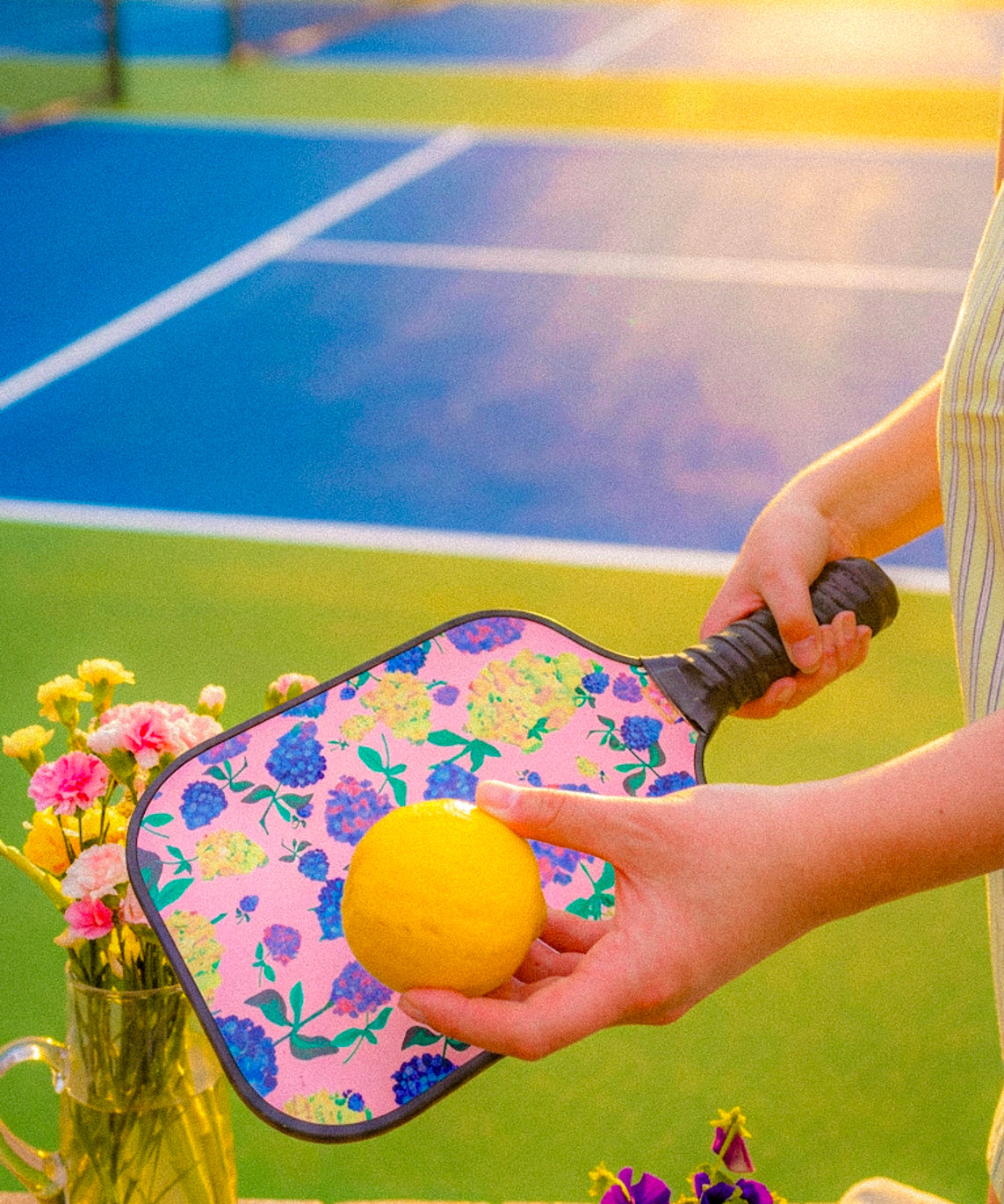 Firefly_backgroundbehindsubjectisbrightsunnyoutdoorpickleballcourt_blueandgreenco30919.jpg