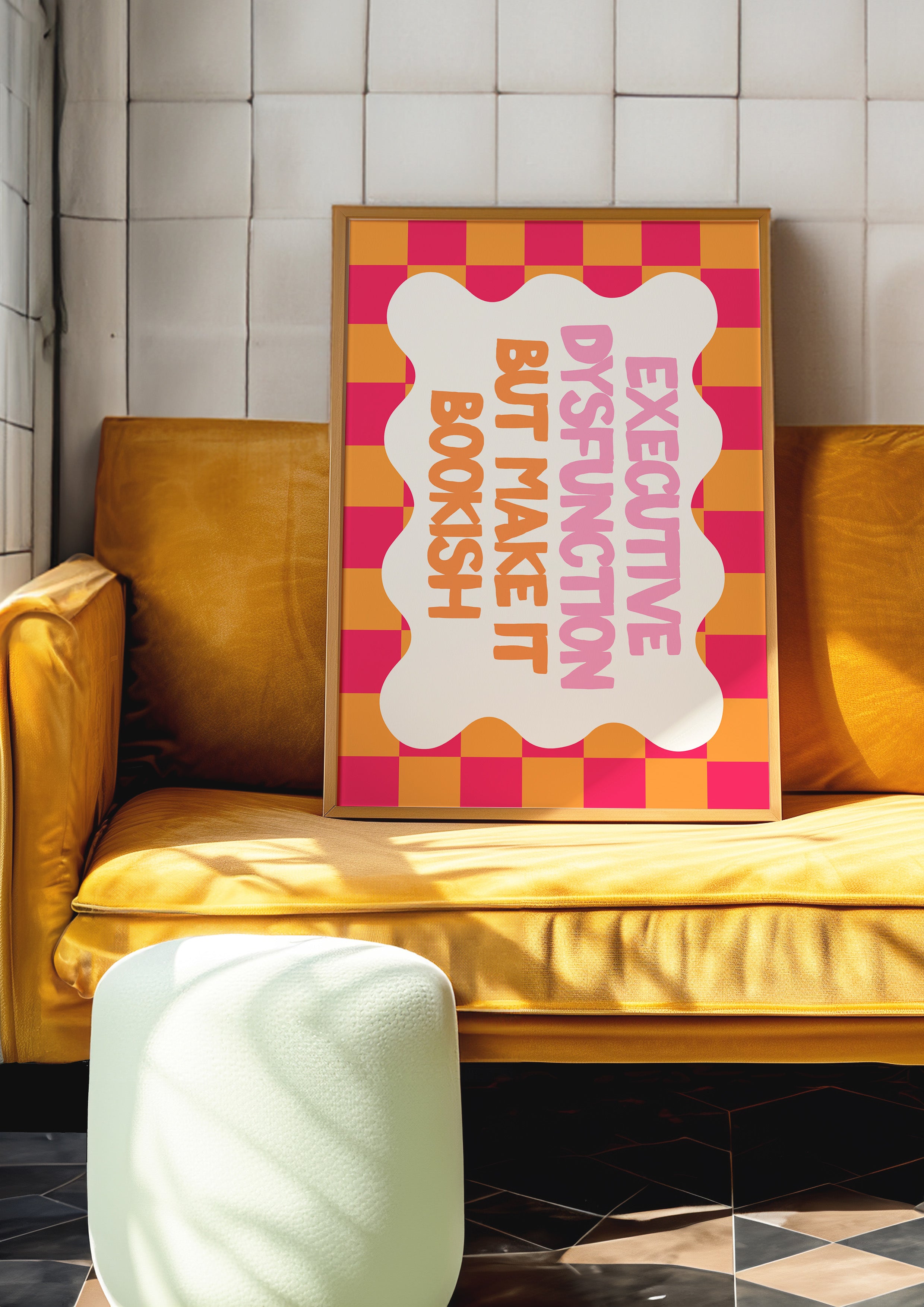 Executive Dysfunction but Make It Bookish 24x36 bookish mental health wall art poster propped on a mustard velvet sofa
