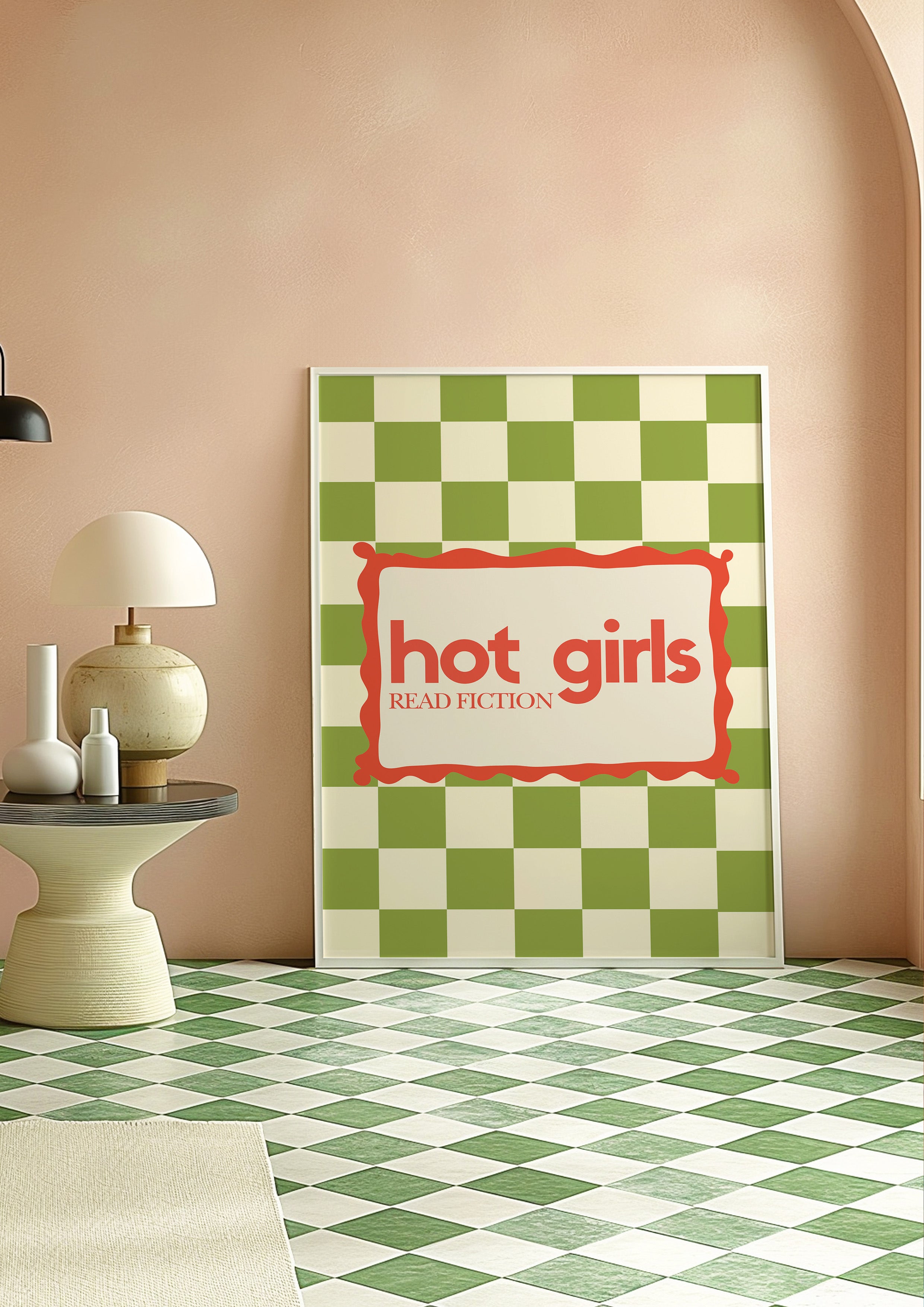 Hot Girls Read Fiction 24x36 bookish wall art poster leaning against a peach wall on a green checkered floor