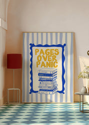 Pages Over Panic 24x36 bookish wall art poster leaning in a pale room with a blue checkered floor and red lamp