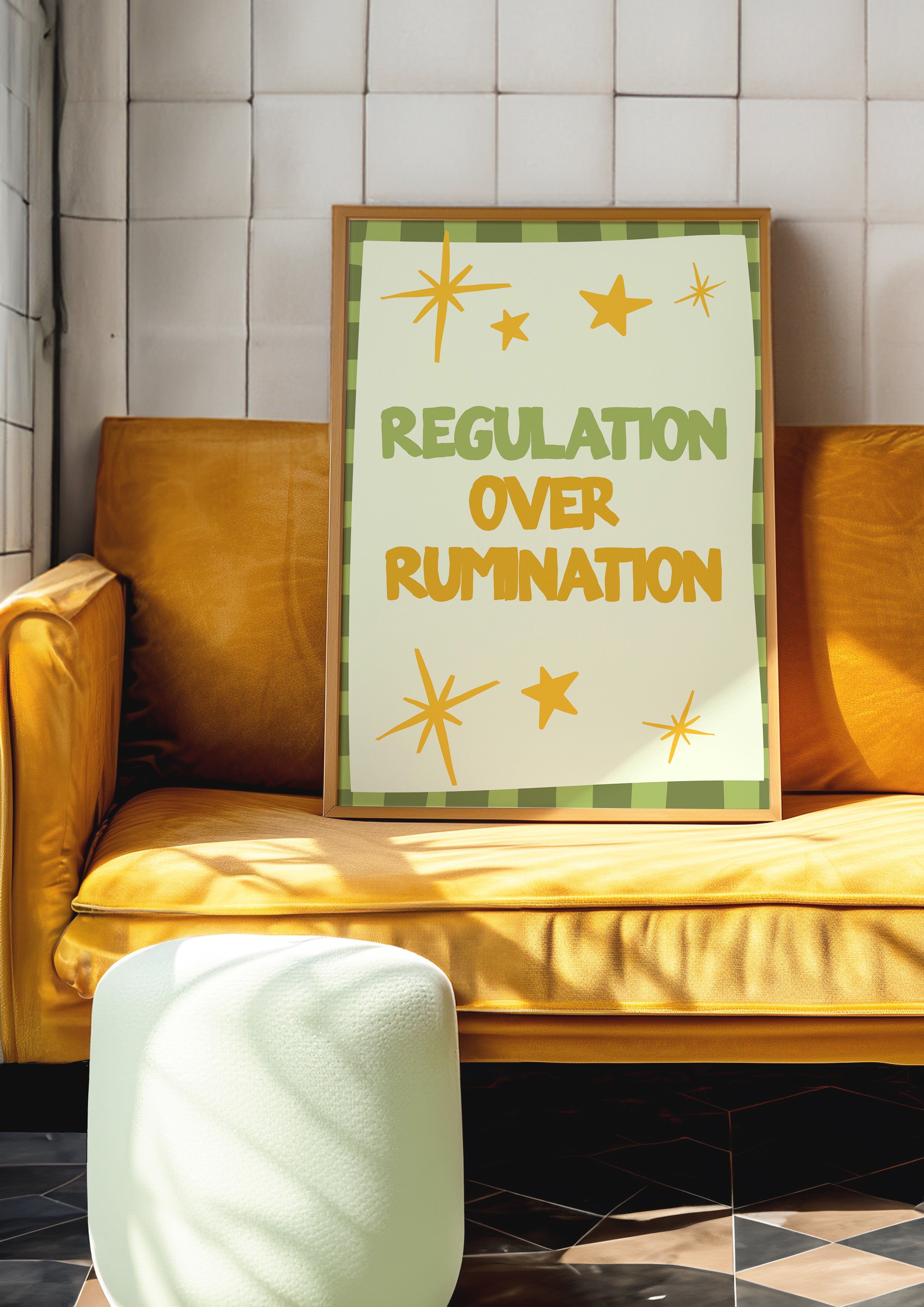 Regulation Over Rumination 24x36 mental health wall art poster propped on a mustard velvet sofa