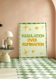 Regulation Over Rumination 24x36 mental health wall art poster leaning against a peach wall on a green checkered floor