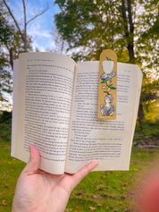 Art Deco Citrus metal bookmark clipped in an open book