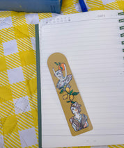 Art Deco Citrus metal bookmark on a notebook on a yellow gingham blanket