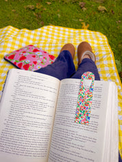 Botanical Garden floral metal bookmark marking a page in East of Eden