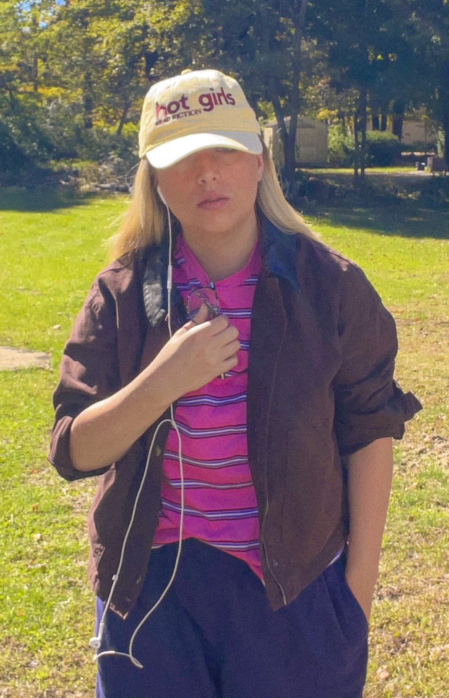 Hot Girls Read Fiction cap styled with a brown jacket and striped tee