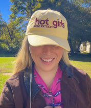 Woman wearing the Hot Girls Read Fiction embroidered coastal washed cap