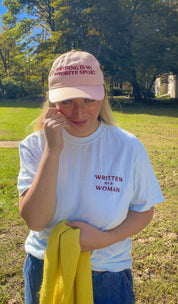 Woman wearing the pink Reading Is My Favorite Sport embroidered coastal washed cap