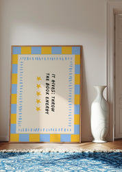 It Gives: Throw the Book Energy 24x36 bookish wall art poster leaning in a bright room on a blue patterned rug